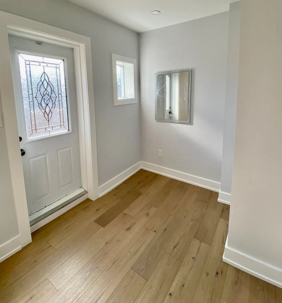 Entryway with warm oak hardwood