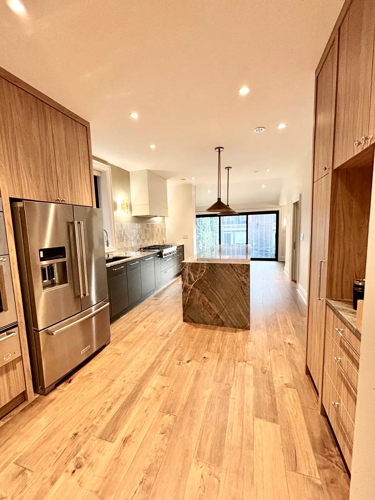 Open plan kitchen with blonde oak hardwood